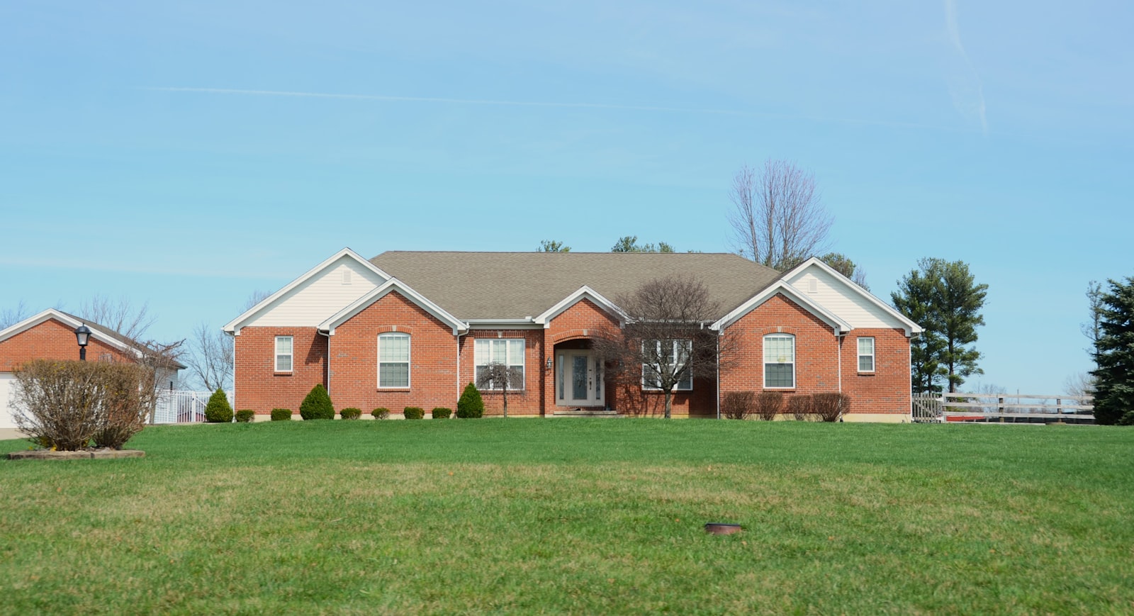 Front lawn at a brick suburban home