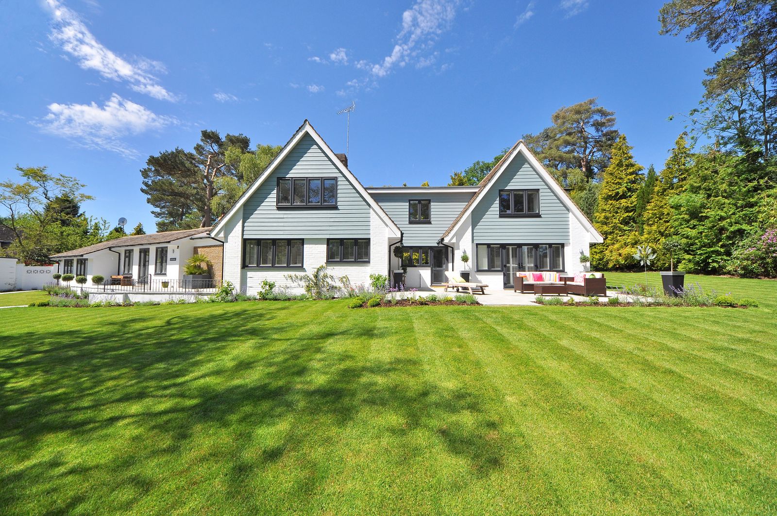 Wide residential lawn with open lot edges