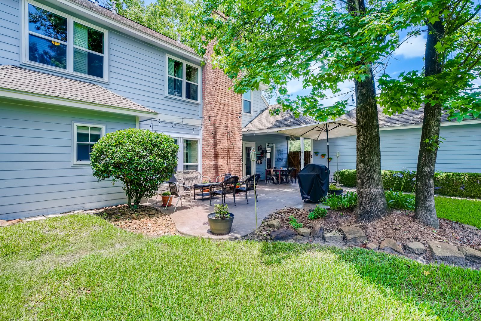 Residential back lawn beside a patio