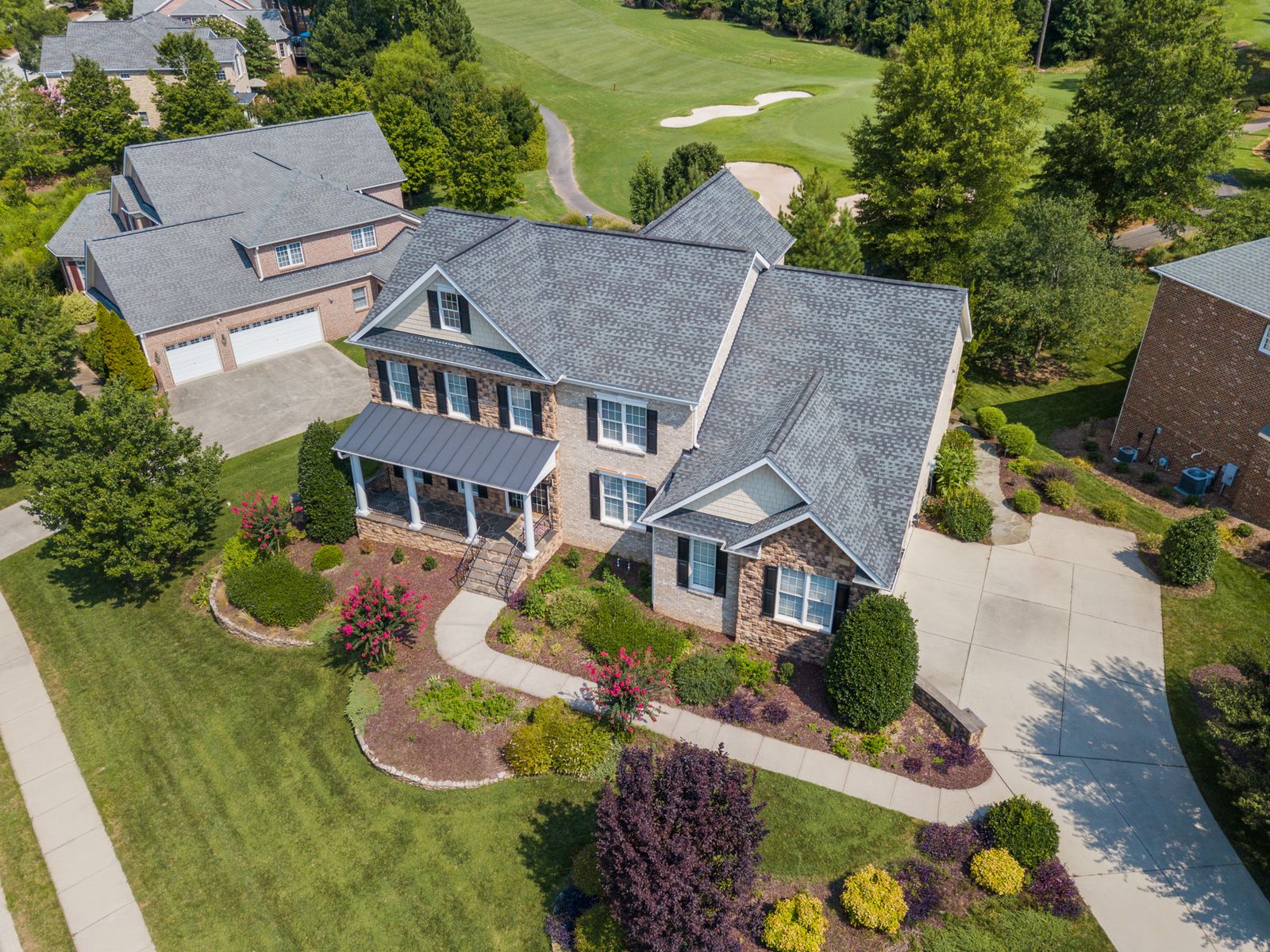 Residential home and lawn viewed from above